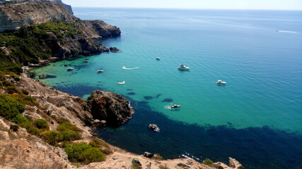 Fototapeta na wymiar Beautiful emerald bay of the Crimean peninsula with yachts