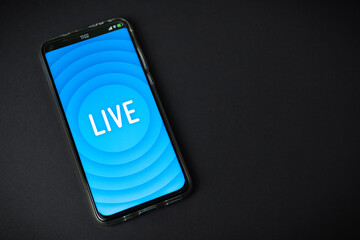 Phone with Live stream logo on black background