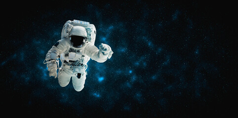 Astronaut spaceman do spacewalk while working for space station in outer space . Astronaut wear...