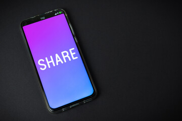 Share - Phone on black background