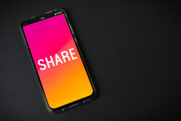 Share - Phone on black background