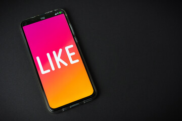 Like - Phone on black background