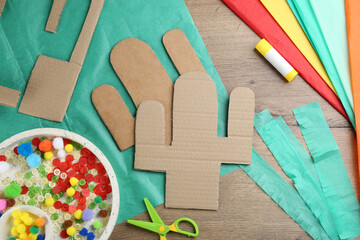 Materials and tools on wooden table, flat lay. Cactus pinata DIY