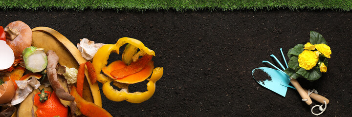 Gardening tools, flower and organic waste for composting on soil, flat lay. Natural fertilizer