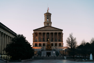 Tennessee State Capitol building and mall in the evening with Christmas tree and lights.