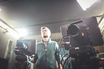 Cameraman operates a film camera, broadcasting recording studio