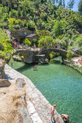 Fototapeta na wymiar View of natural pools in the village of Piodao, the most typical and traditional village in Portugal, with schist houses and bridge over schist