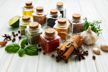 Jars with dried herbs, spices on the table