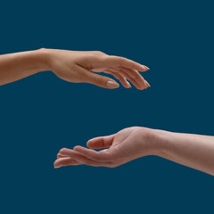 Close up of two open cupped female hands with empty space between them isolated over blue background