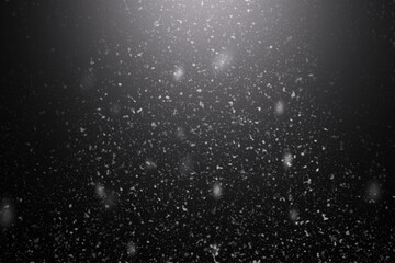 Snowfall on black background, an abstract background