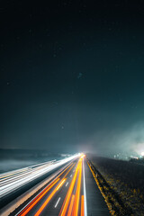 Light trails of cars in the blue midnight time with dark moody vibes