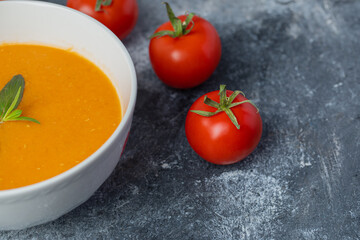 Close up photo of Delicious colored tomato cream-soup