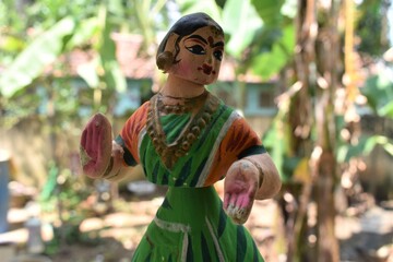 Thanjavur dancing doll in Tamilnadu. Indian toy and traditional dress and ornaments in a Natural background.