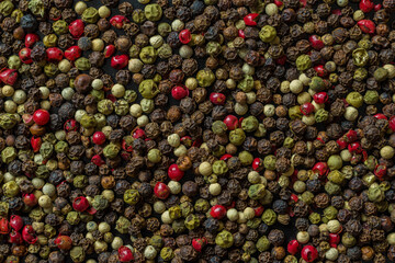 Five kinds of pepper close up. Texture of various peppers. Seasonings and spices from colored peppers.