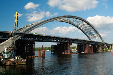 Construction of a new big bridge over a Dnieper river in Kyiv, Ukraine
