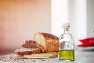 Fototapeta na wymiar Fresh loaf of buckwheat-wheat bread on the table in a light kitchen