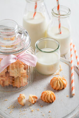 Homemade butter cookies served with milk and straw