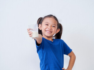 Little girl with glass of milk