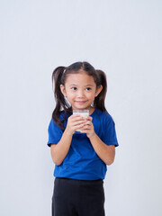 Little girl with glass of milk