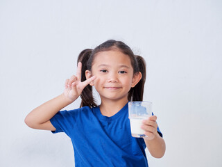 Little girl with glass of milk