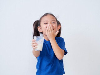 Little girl with glass of milk