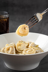 Homemade meat dumplings - russian pelmeni. Dumplings, filled with meat, ravioli.