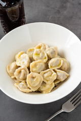 Homemade meat dumplings - russian pelmeni. Dumplings, filled with meat, ravioli.