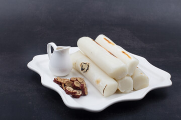 broiled bar rice cake korean food. stick of rounded rice cake.