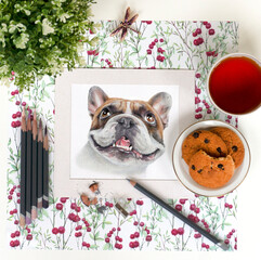 Workplace of the artist with art materials and a portrait of a French bulldog