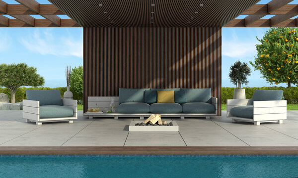 Modern sofa and armchairs by the pool under a wooden roof