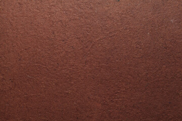 A beautiful brown color handmade paper of rough texture with veins and fibers. Useful for background, 3d rendering.