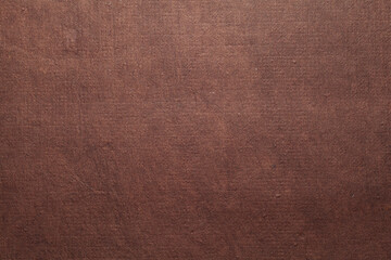 Fototapeta premium A beautiful brown color handmade paper of rough texture with veins and fibers. Useful for background, 3d rendering.