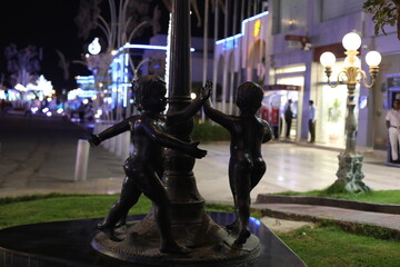 beautiful bronze sculptures at night