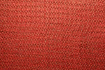 A beautiful red color handmade paper having the texture of grid pattern. Useful for background, 3d rendering.
