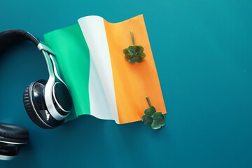 Saint patrick's day background with ireland flag. Religious Christian holiday. Four-leaf clover...