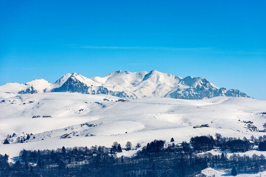 Lessinia High Plateau (Altopiano della Lessinia) and the Mountain range of the Monte Carega in winter with snow, also called the small Dolomites. Veneto and Trentino Alto Adige, Italy, Europe.