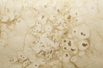 Beautiful golden yellow color handmade paper of marble texture with veins and fibers. Useful for background, 3d rendering.