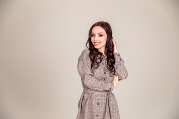 portrait of a beautiful young brunette with long hair. businesswoman