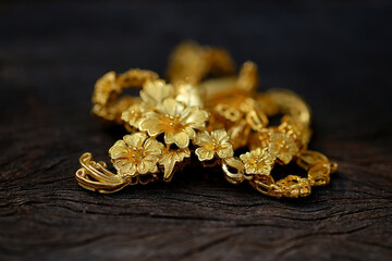 jewelry gold on wood background .