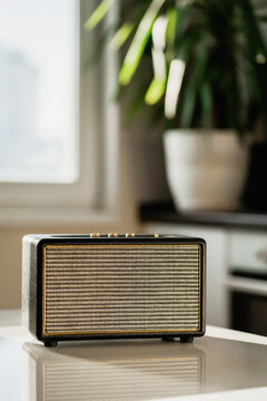 A Vintage Radio Sits On A White Table In The Kitchen. Accepts The Melody Via The Bluetooth Channel. Cheerful Music Plays Loudly. Copy Space. Stylish Receiver