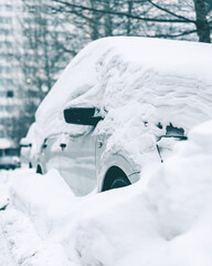 snow covered car. aftermath of a blizzard.