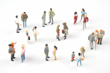 miniature people. different people communicate with each other on a white background