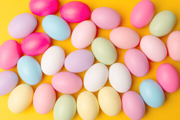 Photo of decorated easter eggs over yellow background.