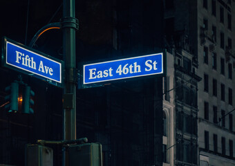 Street sign of Fifth Ave and East 41St with skylines in background.- New York, USA
