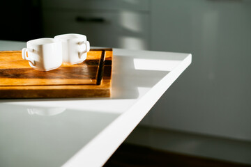 An invigorating delicious drink instead of an energy drink. Ceramic cups of white light coffee. A hot, flavorful drink. Espresso Americano is on the table.