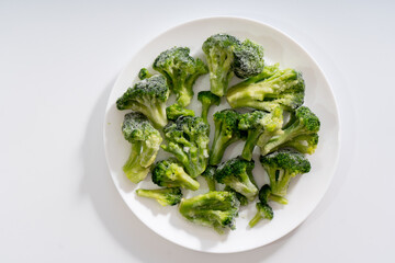 Frozen vegetables. Broccoli. White background