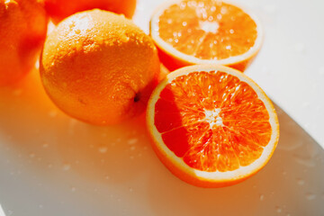 Orange is a seasonal tropical fruit. Citrus is a real living vitamin. Healthy food. Fresh delicious clean. Vegetarian food. There are products on a white table. Healthy lifestyle.