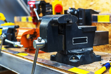 Cast iron vice on the counter of a professional tool store. Close-up