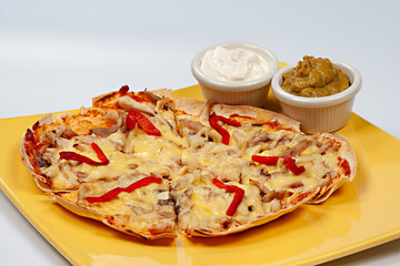 Italian pizza Tortilla with grated Mozzarella