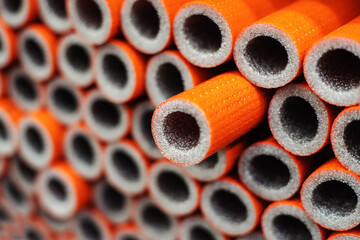 Polyethylene foam pipe insulation. Production and sale of materials for plumbing equipment. Selective focus